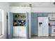 Well-organized laundry closet with washer and dryer in the kitchen at 8245 Manasota Key Rd, Englewood, FL 34223