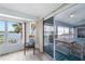 Bright living room with water views and access to a relaxing balcony at 8245 Manasota Key Rd, Englewood, FL 34223