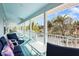 Relaxing covered porch overlooking lush tropical landscape at 8245 Manasota Key Rd, Englewood, FL 34223