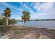 Expansive waterfront view with lush tropical vegetation at 8245 Manasota Key Rd, Englewood, FL 34223