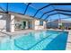 Large, refreshing pool with covered patio at 8565 Saint Kitts Cir, Englewood, FL 34224