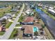 Aerial view showcasing home's location near canal and golf course at 93 Rotonda Cir, Rotonda West, FL 33947