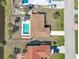 Aerial view showing home's location, pool, and canal at 93 Rotonda Cir, Rotonda West, FL 33947