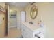 Bright bathroom with white vanity and a large mirror at 93 Rotonda Cir, Rotonda West, FL 33947