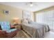 Relaxing bedroom with a comfortable bed and sliding door access at 93 Rotonda Cir, Rotonda West, FL 33947