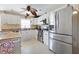 Bright kitchen with stainless steel appliances and granite countertops at 93 Rotonda Cir, Rotonda West, FL 33947