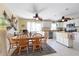Kitchen with island, stainless steel appliances, and dining area at 93 Rotonda Cir, Rotonda West, FL 33947