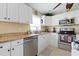 Modern kitchen with stainless steel appliances and granite countertops at 93 Rotonda Cir, Rotonda West, FL 33947