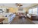 Bright living room with comfy sofas, coffee table, and large windows at 93 Rotonda Cir, Rotonda West, FL 33947