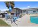 Outdoor space with pool, patio furniture, and grill at 93 Rotonda Cir, Rotonda West, FL 33947