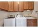 Laundry room with front-load washer and dryer at 9507 Carnaby Dr, Venice, FL 34293