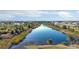 Gorgeous aerial view of the community pond offers peaceful tranquility at 9700 Fiddlers Green Cir # 117, Rotonda West, FL 33947