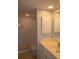 Bathroom featuring tiled walk-in shower and vanity with a sink at 9700 Fiddlers Green Cir # 117, Rotonda West, FL 33947