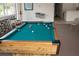 Game room featuring a pool table with colorful balls, seating, and natural light at 9700 Fiddlers Green Cir # 117, Rotonda West, FL 33947