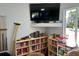 Game room featuring bookshelves, pool cues, and tv at 9700 Fiddlers Green Cir # 117, Rotonda West, FL 33947