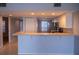 The open kitchen features modern appliances and a convenient breakfast bar, great for entertaining at 9700 Fiddlers Green Cir # 117, Rotonda West, FL 33947