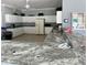 Spacious kitchen with white cabinets, neutral countertops, and modern appliances at 9700 Fiddlers Green Cir # 117, Rotonda West, FL 33947