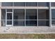 Exterior view of screened porch offers ample light and outdoor living at 9700 Fiddlers Green Cir # 117, Rotonda West, FL 33947