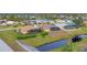 Aerial view of community with lake and houses at 1 Sportsman Ter, Rotonda West, FL 33947