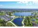 Aerial view of community amenities including lake and clubhouse at 1 Sportsman Ter, Rotonda West, FL 33947