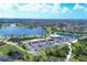 Aerial view of community amenities including lake and clubhouse at 1 Sportsman Ter, Rotonda West, FL 33947