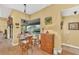 Cozy breakfast nook with table and chairs near a window at 1 Sportsman Ter, Rotonda West, FL 33947