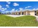 Community clubhouse patio with grassy area at 1 Sportsman Ter, Rotonda West, FL 33947