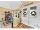 Farmhouse-style dining room with a wooden table and hutch at 1 Sportsman Ter, Rotonda West, FL 33947