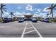 Community clubhouse entrance with parking spaces at 1 Sportsman Ter, Rotonda West, FL 33947