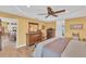 Main bedroom with king bed, dresser, and views into the living area at 1 Sportsman Ter, Rotonda West, FL 33947