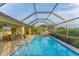 Inviting screened pool area with patio furniture, perfect for relaxation at 1 Sportsman Ter, Rotonda West, FL 33947