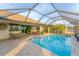 Spacious screened pool and patio with seating area at 1 Sportsman Ter, Rotonda West, FL 33947