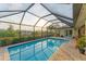 Enjoy the sunset view from this screened pool at 1 Sportsman Ter, Rotonda West, FL 33947