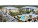 Aerial view of community with pool, buildings, and parking at 102 Natures Way # 2305, Rotonda West, FL 33947