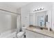 Clean bathroom with tub, shower, and granite countertop at 102 Natures Way # 2305, Rotonda West, FL 33947