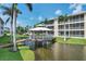 Gazebo with wooden deck over water at 102 Natures Way # 2305, Rotonda West, FL 33947