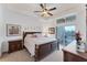 Large main bedroom with ensuite bathroom and access to balcony at 102 Natures Way # 2305, Rotonda West, FL 33947