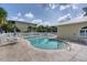 Community pool with lounge chairs at 102 Natures Way # 2305, Rotonda West, FL 33947