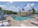 Community pool with lounge chairs at 102 Natures Way # 2305, Rotonda West, FL 33947