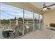 Screened balcony with pond view and seating at 102 Natures Way # 2305, Rotonda West, FL 33947