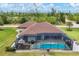 Aerial view of home with pool and large backyard at 10451 Hatchett Cir, Port Charlotte, FL 33981