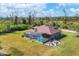 Aerial view of house, pool, and large backyard at 10451 Hatchett Cir, Port Charlotte, FL 33981