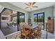 Bright dining room with sliding glass doors leading to the pool and patio area at 10451 Hatchett Cir, Port Charlotte, FL 33981