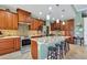 Gourmet kitchen featuring wood cabinets and a large island at 10451 Hatchett Cir, Port Charlotte, FL 33981