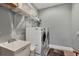 Laundry room with washer, dryer, and utility sink at 10451 Hatchett Cir, Port Charlotte, FL 33981