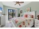 Main bedroom with private access to the backyard patio and garden views at 10451 Hatchett Cir, Port Charlotte, FL 33981