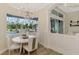 Bright dining room with a chandelier, large windows, and wainscoting at 1061 Boundary Blvd, Rotonda West, FL 33947