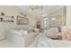 Bright and airy living room with white furniture, decorative accents, and a view of the front entrance and dining area at 1061 Boundary Blvd, Rotonda West, FL 33947