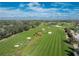 Aerial view of the golf course at 10820 Trophy Dr, Englewood, FL 34223