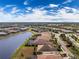 Aerial view of a house and its surroundings in a residential community at 10820 Trophy Dr, Englewood, FL 34223